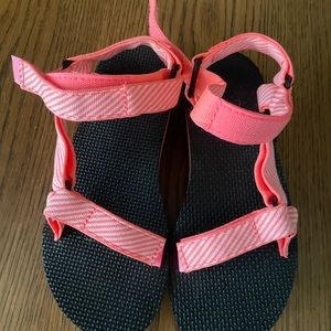 Teva orange and white platform sandals, size 7.